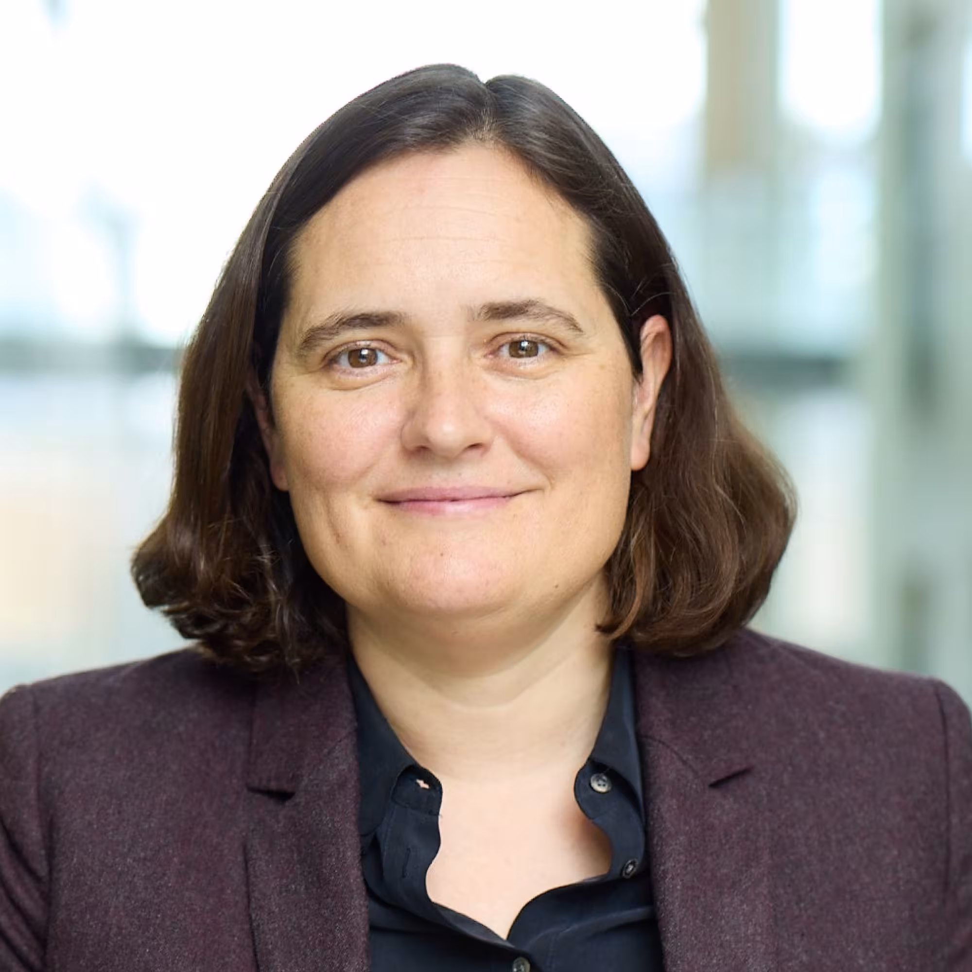 Portrait of Professor Charlotte Williams, a white lady with shoulder-length brown hair wearing a smart jacket.