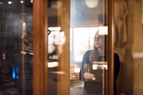 A woman standing in front of a museum case