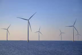 Wind turbines in an offshore wind park producing electricity.