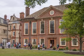 Prospective students and their families look around Somerville College.