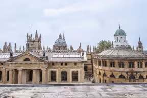 View over Oxford featuring the Sheldonian Theatre, Clarendon Building and Radcliffe Camera.