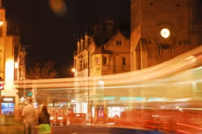 Looking down Queens street at night taken from the High street Junction