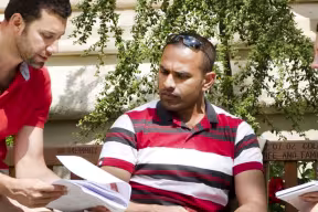 MBA students enjoy the sunshine on a summers afternoon