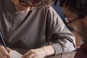 Two people sitting at a table