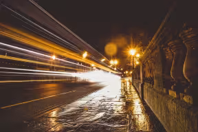 The city lights of Oxford at night, on Magdalen Bridge.
