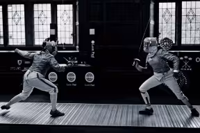 Sabreurs compete in the varsity fencing competition