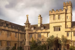 The golden pelican at the top of the Pelican Sundial in the main quad of Corpus Christi College.