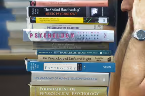 A stack of textbooks on psychology