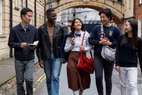 Students walking in front of the Bridge of Sighs