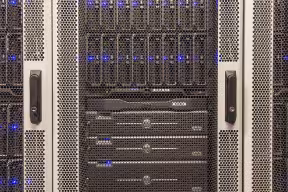Computer nodes from a computer cluster caged in their racks