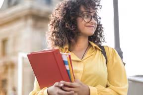 Student on staircase looking to her left