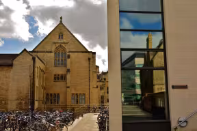 Mansfield College is shown on the left, with the Department of Chemistry reflected in the glass of the Rothermere American Institute.