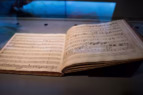 Musical score on display in the Blackwell Hall within the Weston Library