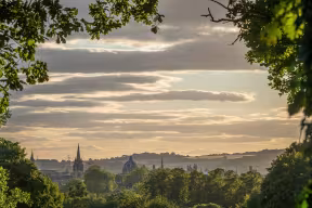  THE OXFORD SKYLINE THROUGH THE TREES AT SUNRISE