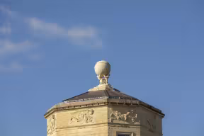 The statues of Atlas and Hercules holding the globe atop the Radcliffe Observatory.