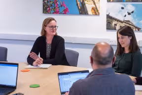 a group of staff having a meeting