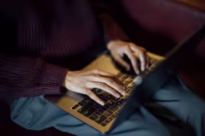 STUDENT USING THEIR LAPTOP