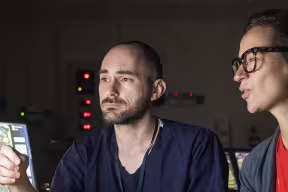 researchers looking at scans