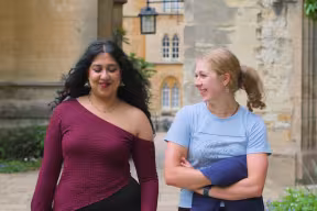 Students walking and chatting in college quad