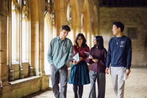 Students walking through the cloisters at New College