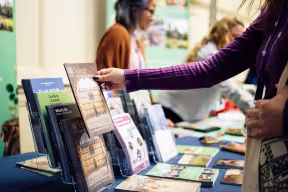 Looking at brochures on an exhibition stand