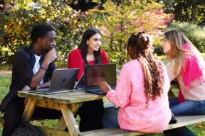 Students on an outdoor bench