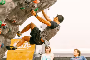 Student rockclimbing