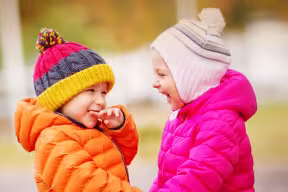 Two children looking happy