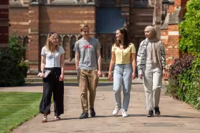 students walking in a college quad