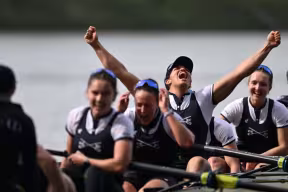 A rowing boat with women celebrating
