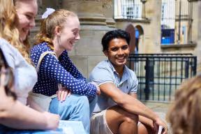 Students sitting on Clarendon Building steps