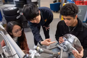 Formula 1 Scholar Sean (right) works alongside his classmates on the MEng in Engineering Science. 