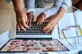 Woman and child using a laptop
