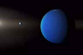 Illustration of a large, spherical blue planet in outer space with another planet and a star in the far distance.