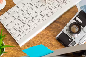 camera next to a keyboard