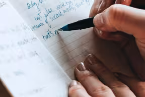 hand writing in notebook