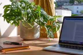 laptop and notebook on desk