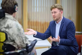 Careers adviser in careers advice appointment with student in person