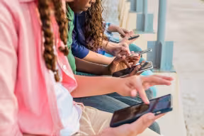 Teenagers using mobile phones