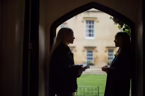 COUPLE OF STUDENTS CHATTING AT LINCOLN COLLEGE