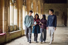 STUDENTS WALKING IN THE CLOISTERS, NEW COLLEGE