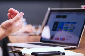 hand and computer screen