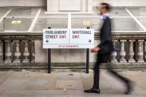 Sign pointing to Whitehall and Parliament Street, representing careers in UK government and the public sector.
