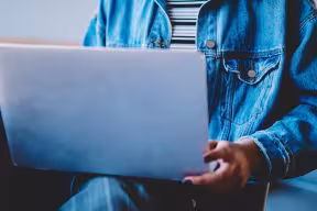 person holding a laptop