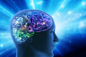 Human head with a luminous brain network, against a backdrop with flashes and spots of light.