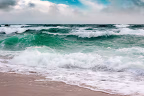 Scene of waves lapping against a shore