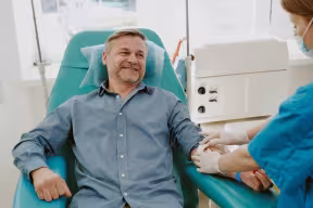 Man having blood taken at medical clinic