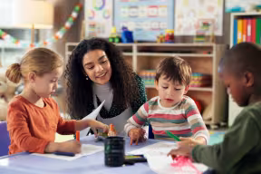 Teacher and young children in a classroom