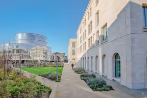 Outside the Schwarzman Centre for the Humanities at Oxford, with the Blavatnik School of Government in the background.