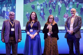 Photo | Profs Gilbert, Lambe and Pollard collecting the Global Impact and Innovation Award